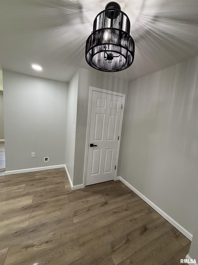 116 Lindsey Ave, Metropolis, IL 62960 - detailed view of wood finished floors, baseboards, and a chandelier