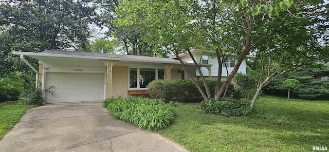 1608 W Briarwood Dr, Carbondale, IL 62901 - split level home featuring a garage, concrete driveway, brick siding, and a front lawn