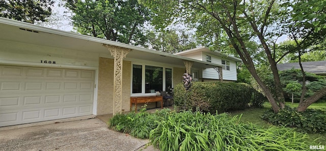 1608 W Briarwood Dr, Carbondale, IL 62901 - view of front facade with brick siding, concrete driveway, and a garage