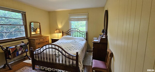 1608 W Briarwood Dr, Carbondale, IL 62901 - bedroom featuring wood finished floors and wood walls