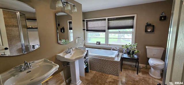 1608 W Briarwood Dr, Carbondale, IL 62901 - full bathroom with a sink, toilet, a bath, and baseboards