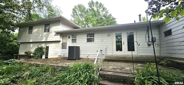 1608 W Briarwood Dr, Carbondale, IL 62901 - rear view of house with french doors, central AC, and a patio