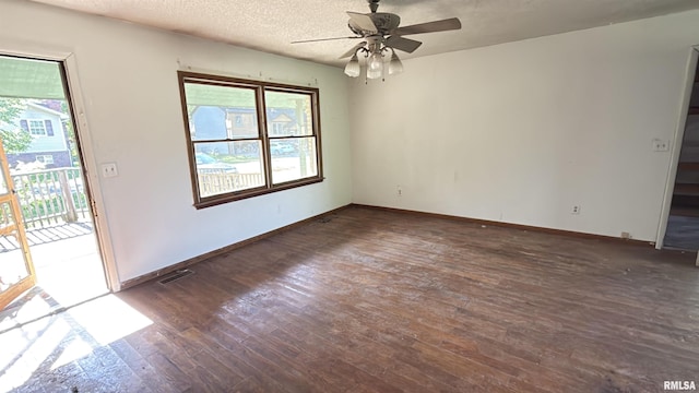 102 Stable Dr, Carterville, IL 62918 - empty room featuring healthy amount of natural light, dark wood-style flooring, a ceiling fan, baseboards, and a textured ceiling