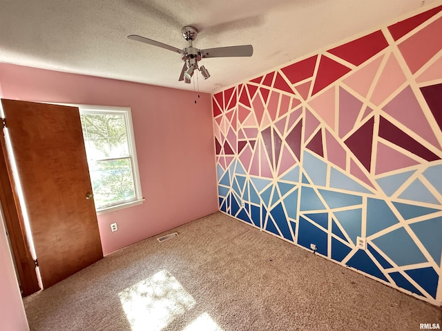 102 Stable Dr, Carterville, IL 62918 - carpeted spare room featuring a ceiling fan and a textured ceiling