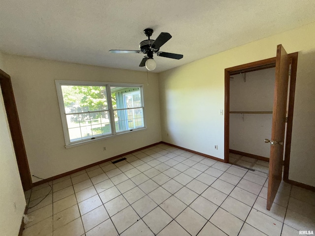 102 Stable Dr, Carterville, IL 62918 - unfurnished bedroom featuring a closet, ceiling fan, and baseboards
