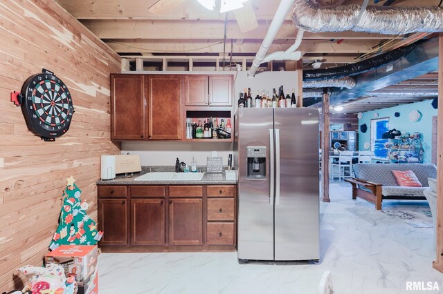 11782 Driftwood Dr, Marion, IL 62959 - kitchen with stainless steel fridge with ice dispenser, wooden walls, light marble finish floors, a sink, and ceiling fan