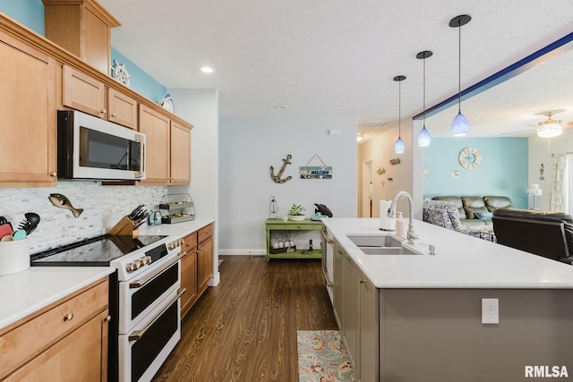 11782 Driftwood Dr, Marion, IL 62959 - kitchen with white appliances, a sink, open floor plan, dark wood finished floors, and backsplash