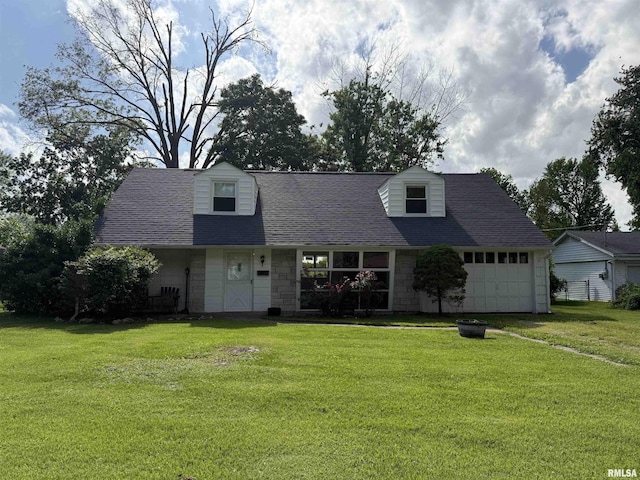 19 Park Ln, Centralia, IL 62801 - cape cod home featuring a front lawn, a shingled roof, and an attached garage