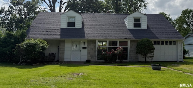 19 Park Ln, Centralia, IL 62801 - cape cod house featuring a front lawn, stone siding, and a shingled roof