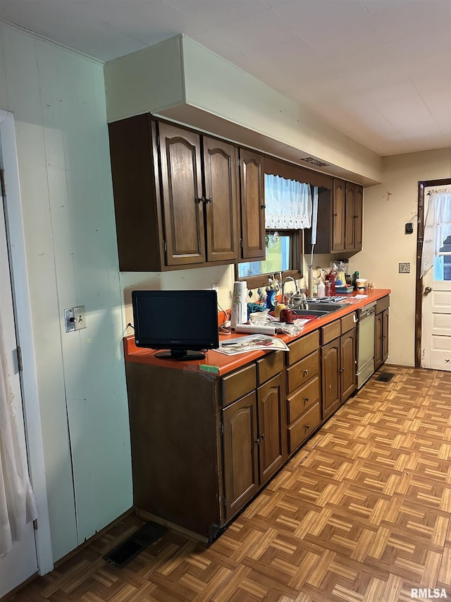 1480 Hemlock Rd, Duquoin, IL 62832 - kitchen featuring dishwashing machine, dark brown cabinetry, and a sink