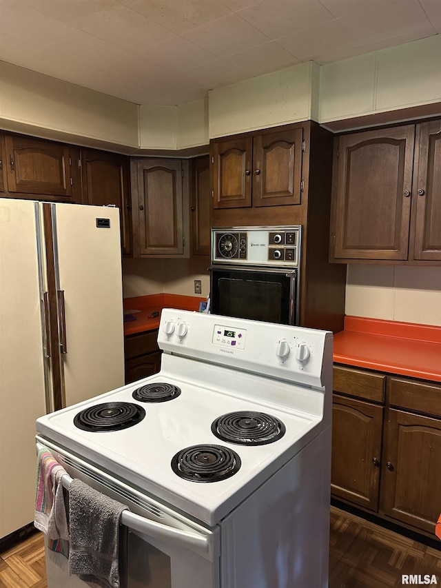 1480 Hemlock Rd, Duquoin, IL 62832 - kitchen featuring white appliances and dark brown cabinetry