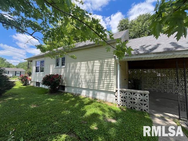 475 Holt St, Vergennes, IL 62994 - view of home's exterior featuring a lawn