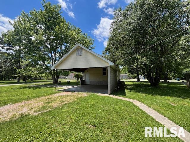475 Holt St, Vergennes, IL 62994 - view of home's exterior with a lawn and a carport