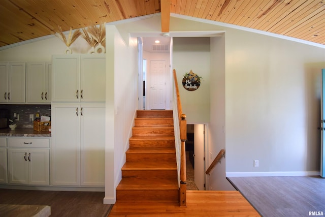 2704 Jamison Blvd, Mount Vernon, IL 62864 - staircase featuring lofted ceiling, wood finished floors, wooden ceiling, crown molding, and baseboards