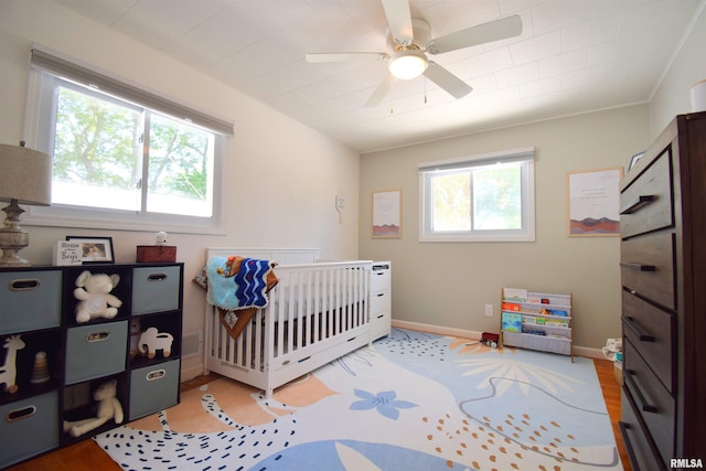 2704 Jamison Blvd, Mount Vernon, IL 62864 - bedroom with a crib, baseboards, and a ceiling fan