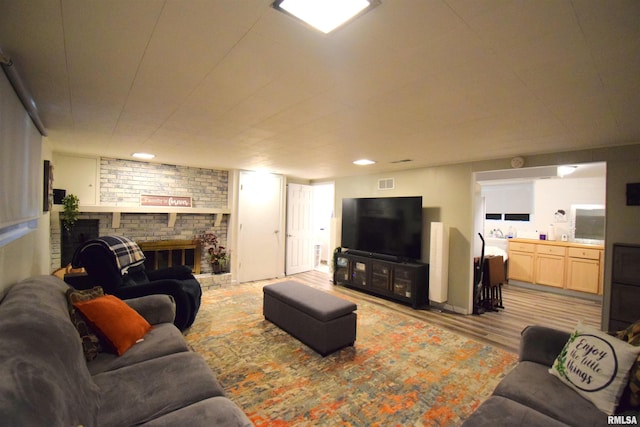 2704 Jamison Blvd, Mount Vernon, IL 62864 - living room with a fireplace and light wood-type flooring