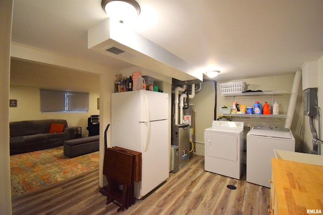 2704 Jamison Blvd, Mount Vernon, IL 62864 - laundry area with light wood-style floors and independent washer and dryer
