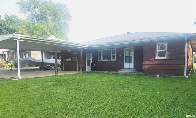 422 E Dr, Flora, IL 62839 - view of front of home with entry steps, a front yard, a carport, and roof with shingles
