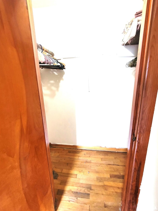 422 E Dr, Flora, IL 62839 - spacious closet featuring wood finished floors