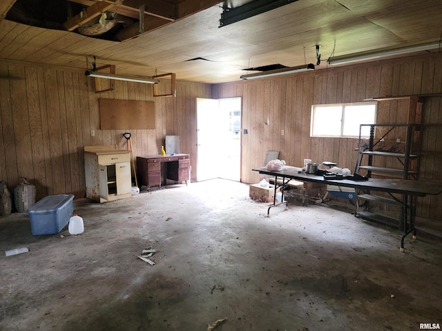 422 E Dr, Flora, IL 62839 - garage featuring wooden walls and a workshop area