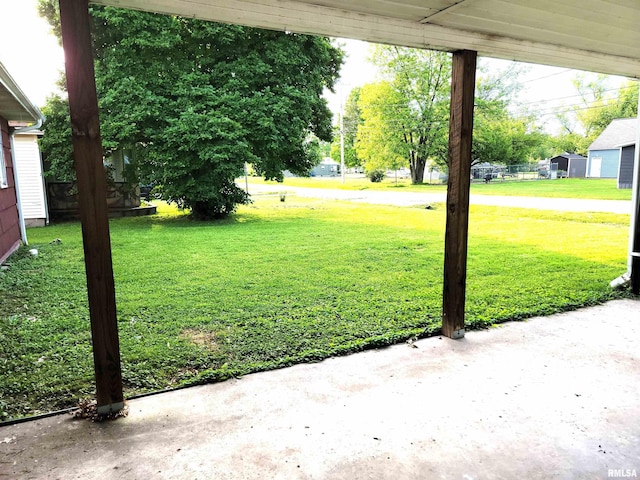 422 E Dr, Flora, IL 62839 - view of green lawn with a patio