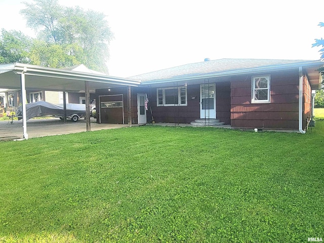 422 E Dr, Flora, IL 62839 - single story home with a front lawn, entry steps, and an attached carport