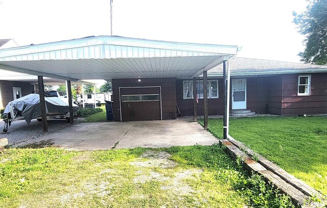 422 E Dr, Flora, IL 62839 - view of front of home featuring a front yard, a carport, and entry steps