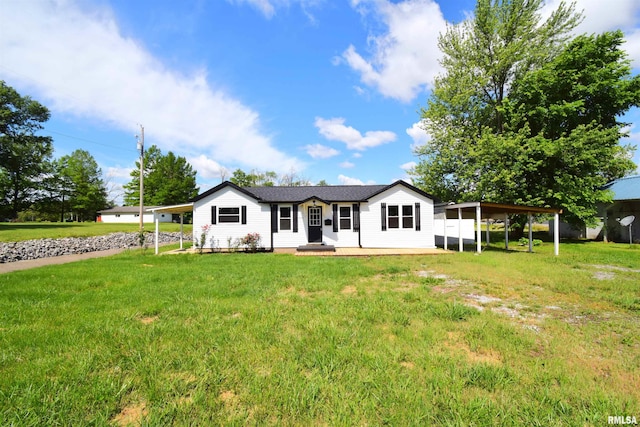 403 S Elm St, Ina, IL 62846 - view of front of home featuring a front yard and a carport
