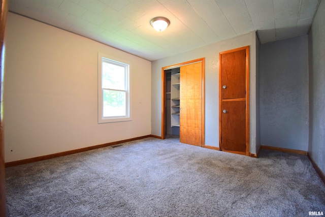 403 S Elm St, Ina, IL 62846 - unfurnished bedroom featuring carpet floors, a closet, and baseboards