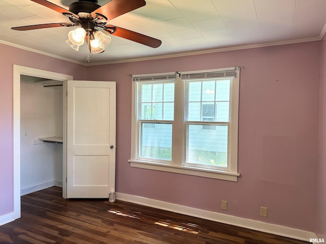 504 S James St, Carbondale, IL 62901 - unfurnished bedroom featuring dark wood-style flooring, baseboards, crown molding, and a ceiling fan
