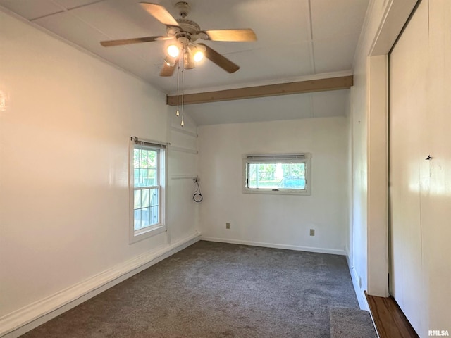 504 S James St, Carbondale, IL 62901 - spare room featuring healthy amount of natural light, dark carpet, a ceiling fan, and baseboards