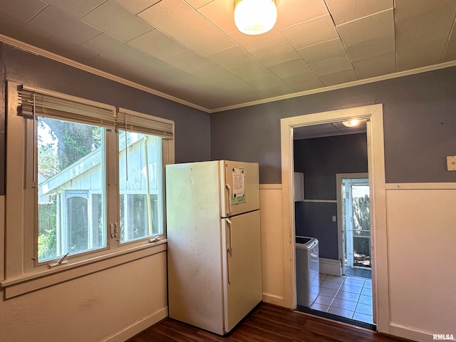 504 S James St, Carbondale, IL 62901 - kitchen featuring freestanding refrigerator, dark wood-style floors, crown molding, and washer / clothes dryer
