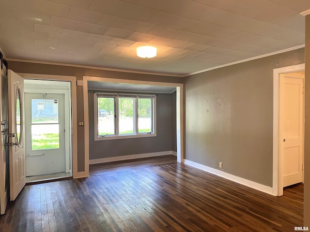504 S James St, Carbondale, IL 62901 - unfurnished room with ornamental molding, dark wood-style flooring, and baseboards