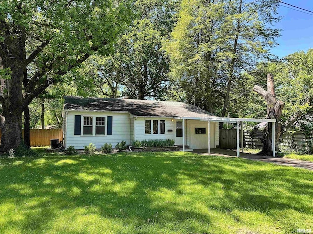 504 S James St, Carbondale, IL 62901 - view of front facade with cooling unit and a carport