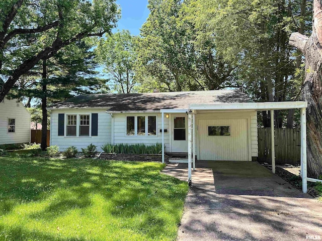 504 S James St, Carbondale, IL 62901 - view of front of property featuring driveway and a carport
