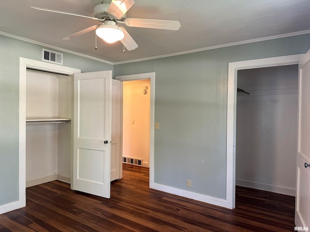 504 S James St, Carbondale, IL 62901 - unfurnished bedroom featuring dark wood finished floors, crown molding, a closet, baseboards, and ceiling fan