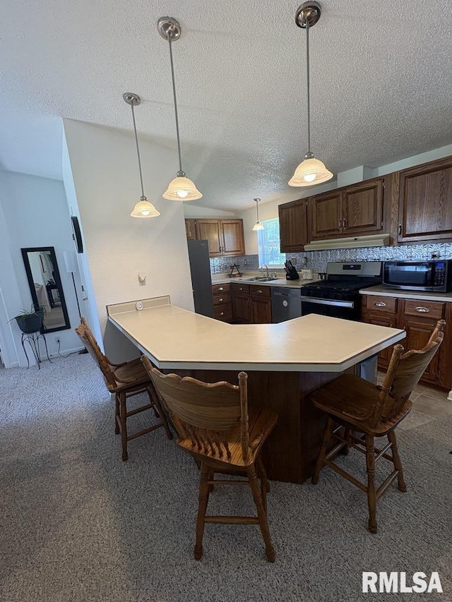 17227 Number 9 Blacktop Blacktop, West Frankfort, IL 62896 - kitchen with black appliances, a breakfast bar, light countertops, a sink, and a textured ceiling