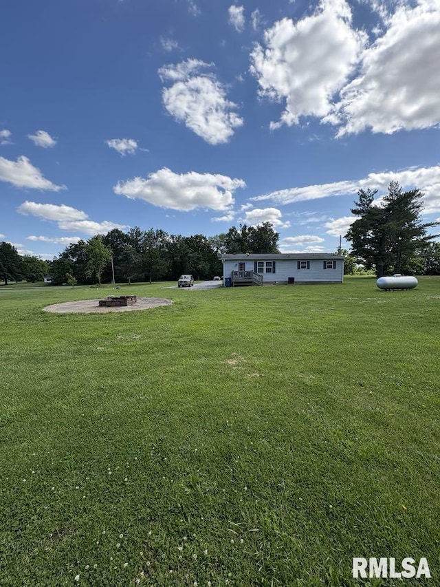17227 Number 9 Blacktop Blacktop, West Frankfort, IL 62896 - view of grassy yard with an outdoor fire pit