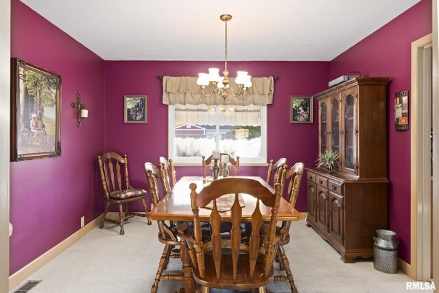 49 Jon St, Metropolis, IL 62960 - dining space featuring a chandelier, light carpet, and baseboards