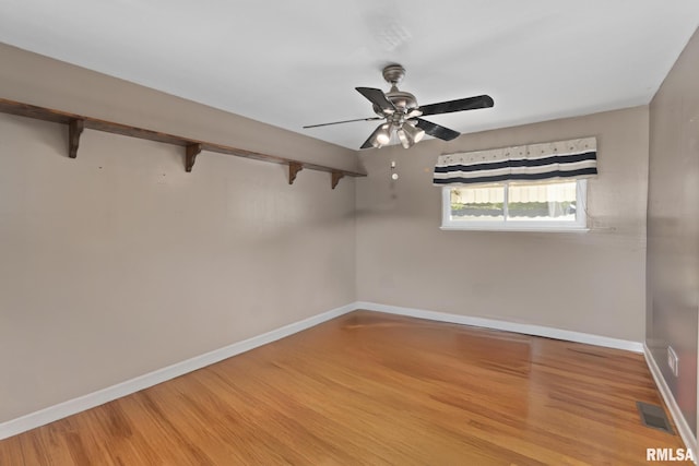 49 Jon St, Metropolis, IL 62960 - empty room with baseboards, light wood-type flooring, and a ceiling fan