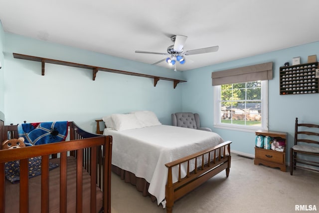 49 Jon St, Metropolis, IL 62960 - bedroom with light colored carpet, baseboards, and a ceiling fan