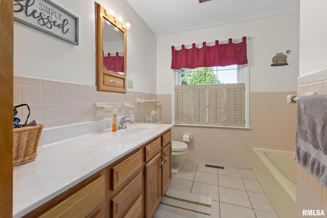 49 Jon St, Metropolis, IL 62960 - bathroom featuring tile walls, tile patterned floors, toilet, wainscoting, and vanity