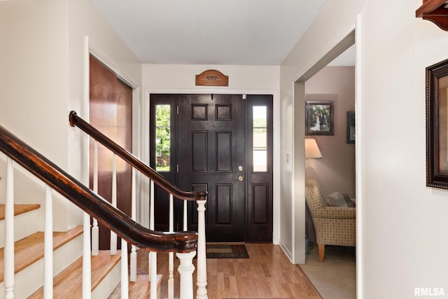 49 Jon St, Metropolis, IL 62960 - foyer featuring wood finished floors, stairway, and baseboards