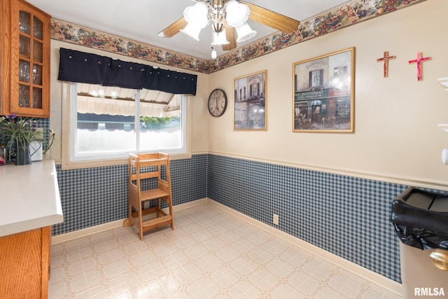 49 Jon St, Metropolis, IL 62960 - dining space with wainscoting, light floors, ceiling fan, and baseboards