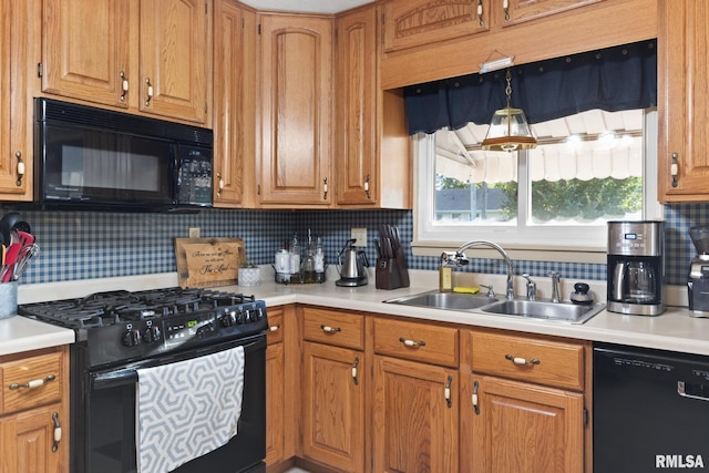 49 Jon St, Metropolis, IL 62960 - kitchen with black appliances, a sink, light countertops, backsplash, and brown cabinetry