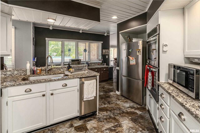 415 E Reichert Dr, Marion, IL 62959 - kitchen featuring stainless steel appliances, a sink, white cabinetry, light stone countertops, and stone finish floors
