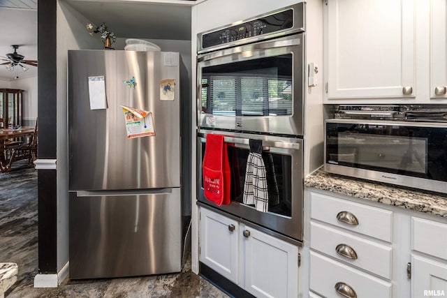 415 E Reichert Dr, Marion, IL 62959 - kitchen with appliances with stainless steel finishes, ceiling fan, white cabinetry, and light stone counters
