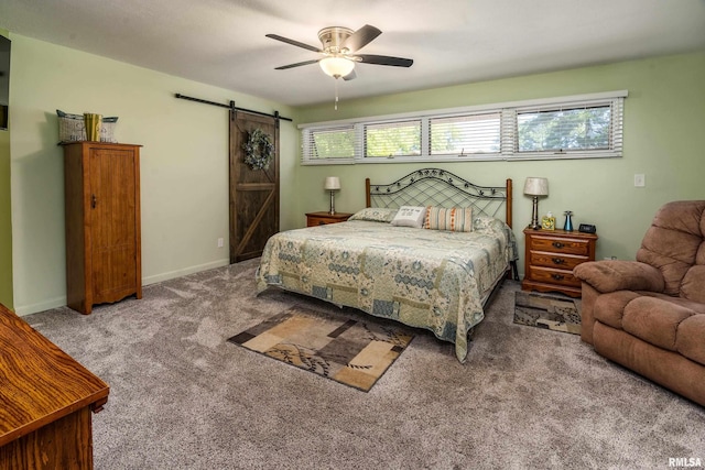 415 E Reichert Dr, Marion, IL 62959 - bedroom with a barn door, carpet flooring, a ceiling fan, and baseboards