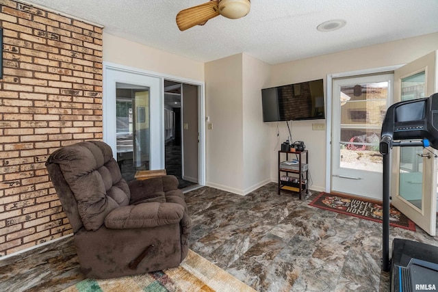 415 E Reichert Dr, Marion, IL 62959 - living area featuring a textured ceiling and a ceiling fan
