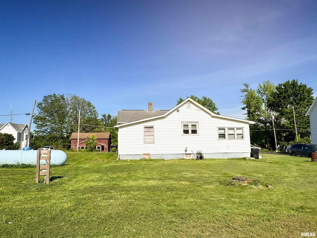135 Walnut St, Alto Pass, IL 62905 - rear view of property featuring a lawn and a chimney